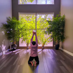 An image showcasing a serene indoor setting, with a person engaging in exercise, surrounded by plants, natural light, and calming colors